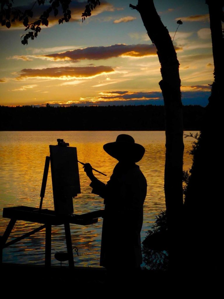 Judith painting at Grand Lake, New Brunswick